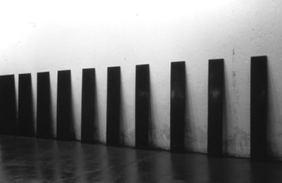    RESONANCE.   1987. Black vatican stone. Ten plates of diminishing width. 48” x 3/4” x 240” overall. 